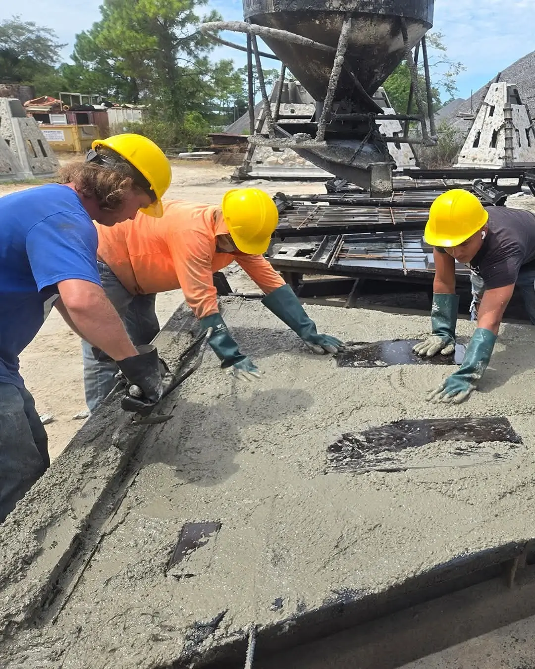 The team hand-finishing marine-grade concrete on a memorial reef.